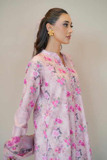 Woman wearing a light pink floral dress - Meryl Wear