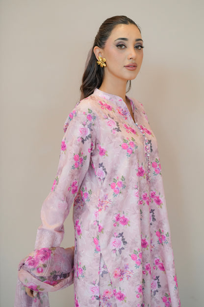 Woman wearing a floral pink and purple outfit sideview - Meryl Wear