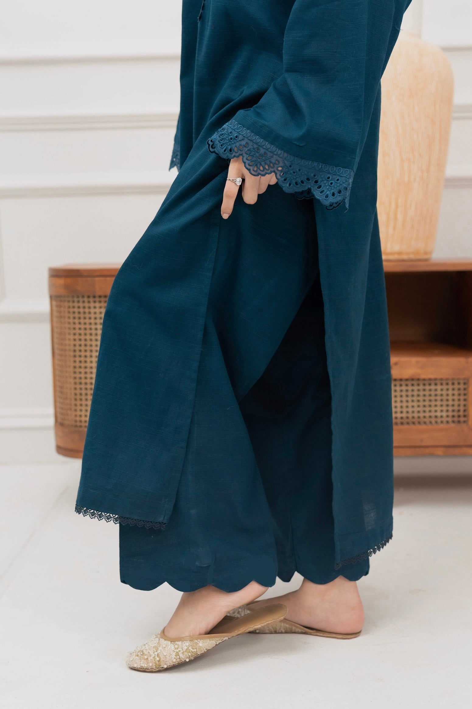 Matching deep teal trousers paired with a women’s khaddar kurta for winter wear.